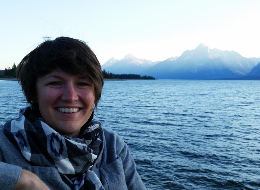 Bethann in front of water and mountains